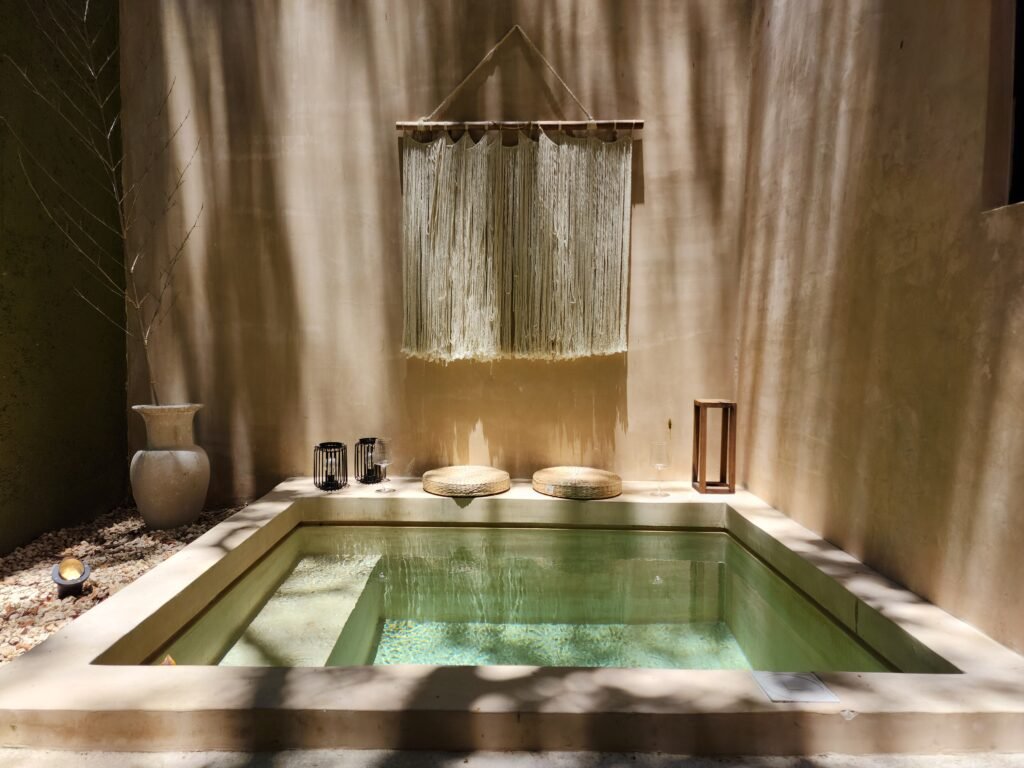 A serene indoor spa setting with natural light and minimalist decor, perfect for relaxation.